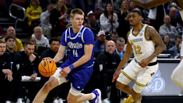 Mar 20, 2025; Wichita, KS, USA; Drake Bulldogs guard Bennett Stirtz (14) dribbles against Missouri Tigers guard Tony Perkins (12) in the second half of a first round men’s NCAA Tournament game at Intrust Bank Arena.