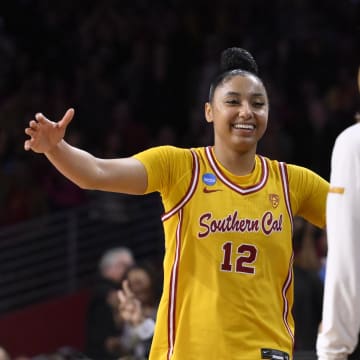 Mar 25, 2024; Los Angeles, CA, USA; USC Trojans guard JuJu Watkins (12) hugs head coach Lindsay Gottlieb during a NCAA Women’s Tournament 2nd round game against the Kansas Jayhawks at Galen Center. Mandatory Credit: Robert Hanashiro-USA TODAY Sports