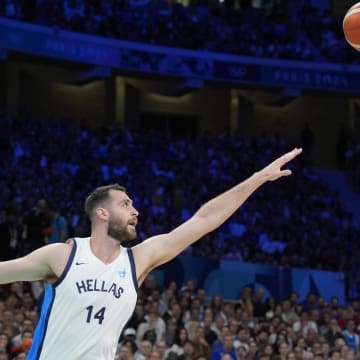 Jul 27, 2024; Villeneuve-d'Ascq, France; Canada small forward Dillon Brooks (24) shoots against Greece centre Georgios Papagiannis (14) in the first quarter during the Paris 2024 Olympic Summer Games at Stade Pierre-Mauroy. Mandatory Credit: John David Mercer-USA TODAY Sports