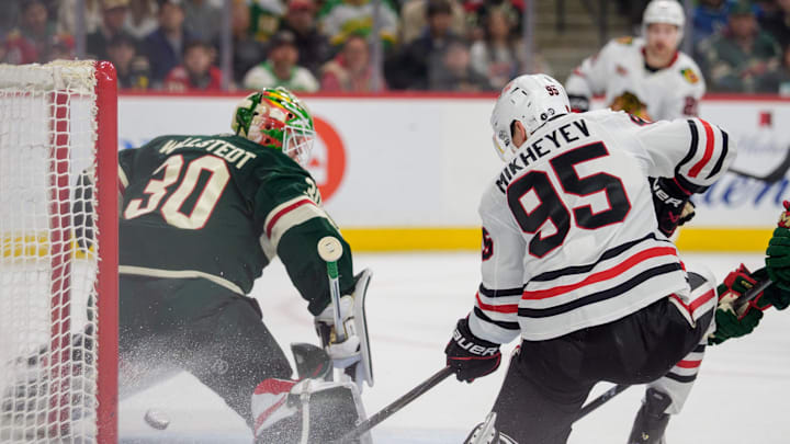 Mar 19, 2026; Saint Paul, Minnesota, USA; Chicago Blackhawks right wing Ilya Mikheyev (95) redirects a pass behind Minnesota Wild goaltender Jesper Wallstedt (30) to score in the first period at Grand Casino Arena. Mandatory Credit: Matt Blewett-Imagn Images