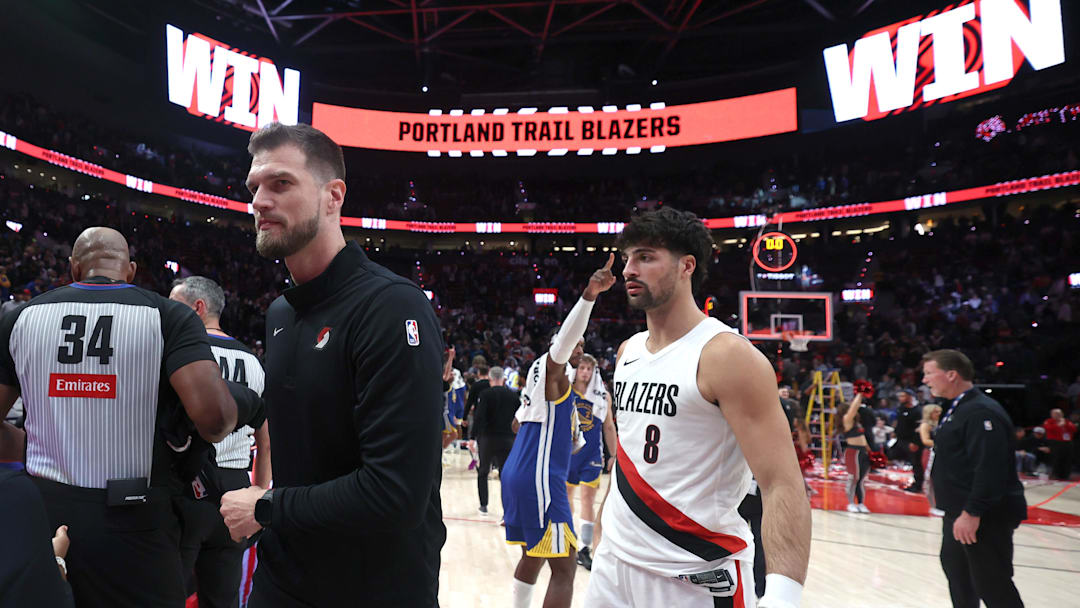 Oct 24, 2025; Portland, Oregon, USA; Portland Trail Blazers interim head coach Tiago Splitter walks towards the locker room with Trail Blazers’ forward Deni Avdija (8) after a 139-119 win over Golden State Warriors in the second half at Moda Center. Mandatory Credit: Jaime Valdez-Imagn Images