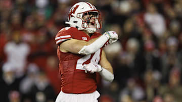 Nov 11, 2023; Madison, Wisconsin, USA;  Wisconsin Badgers safety Hunter Wohler (24) celebrates following a play during the third quarter against the Northwestern Wildcats at Camp Randall Stadium. Mandatory Credit: Jeff Hanisch-Imagn Images