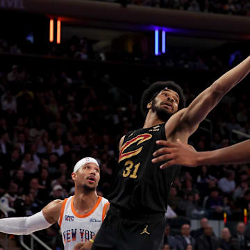 Apr 11, 2025; New York, New York, USA; Cleveland Cavaliers center Jarrett Allen (31) grabs a rebound against New York Knicks guard Josh Hart (3) in front of Cavaliers forward Evan Mobley (4) during the second quarter at Madison Square Garden. Mandatory Credit: Brad Penner-Imagn Images