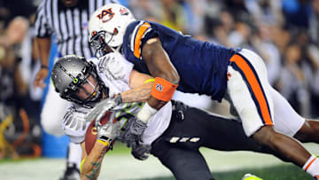 Jan 10, 2011; Glendale, AZ, USA; Oregon Ducks wide receiver Jeff Maehl (23) scores a two-point conversion over Auburn Tigers safety Zac Etheridge (4) during the fourth quarter of the 2011 BCS National Championship game at University of Phoenix Stadium.  Mandatory Credit: Mark J. Rebilas-Imagn Images