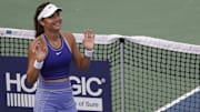 Emma Raducanu waves to the crowd after her match.