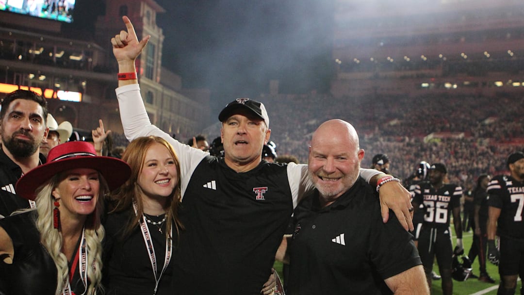 Sep 28, 2024; Lubbock, Texas, USA;  Texas Tech Red Raiders head coach Joey McGuire and associate head coach Kenny Perry after the game against the Cincinnati Bearcats at Jones AT&T Stadium and Cody Campbell Field. Mandatory Credit: Michael C. Johnson-Imagn Images