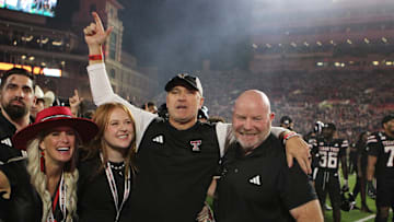 Sep 28, 2024; Lubbock, Texas, USA;  Texas Tech Red Raiders head coach Joey McGuire and associate head coach Kenny Perry after the game against the Cincinnati Bearcats at Jones AT&T Stadium and Cody Campbell Field. Mandatory Credit: Michael C. Johnson-Imagn Images