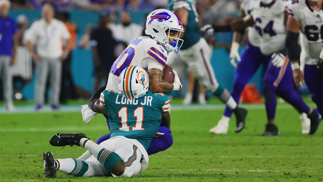 Sep 12, 2024; Miami Gardens, Florida, USA; Buffalo Bills wide receiver Khalil Shakir (10) makes a catch against Miami Dolphins linebacker David Long Jr. (11) during the second quarter at Hard Rock Stadium. Mandatory Credit: Sam Navarro-Imagn Images