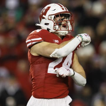 Nov 11, 2023; Madison, Wisconsin, USA;  Wisconsin Badgers safety Hunter Wohler (24) celebrates following a play during the third quarter against the Northwestern Wildcats at Camp Randall Stadium. Mandatory Credit: Jeff Hanisch-USA TODAY Sports