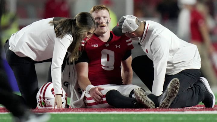 Wisconsin quarterback Billy Edwards Jr. (9) is tended to after being injured during the second quarter of their game against Miami (Ohio) Thursday, August 28, 2025 at Camp Randall Stadium in Madison, Wisconsin. Wisconsin quarterback Billy Edwards Jr. (9) is tended to after being injured during the second quarter of their game against Miami (Ohio) Thursday, August 28, 2025 at Camp Randall Stadium in Madison, Wisconsin.