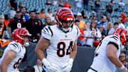 Cincinnati Bengals tight end Tanner McLachlan (84) Cincinnati Bengals tight end Erick All Jr. (83) and other Cincinnati Bengals run onto the field to warm up before NFL preseason game between the Cincinnati Bengals and the Indianapolis Colts at Paycor Stadium in Cincinnati on Thursday, Aug. 22, 2024.