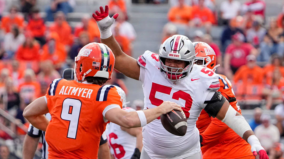 Ohio State Buckeyes defensive lineman Will Smith Jr. (53) pressures Illinois Fighting Illini quarterback Luke Altmyer (9) during the second half of the NCAA football game at Gies Memorial Stadium in Champaign on Oct. 11, 2025. Ohio State won 34-16.