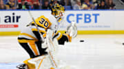 Sep 21, 2024; Buffalo, New York, USA;  Pittsburgh Penguins goalie Joel Blomqvist (30) looks to make a save during the second period against the Buffalo Sabres at KeyBank Center. Mandatory Credit: Timothy T. Ludwig-Imagn Images