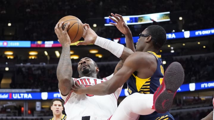 Mar 27, 2024; Chicago, Illinois, USA; Indiana Pacers forward Jalen Smith (25) defends Chicago Bulls center Andre Drummond (3) during the second half at United Center. Mandatory Credit: David Banks-USA TODAY Sports