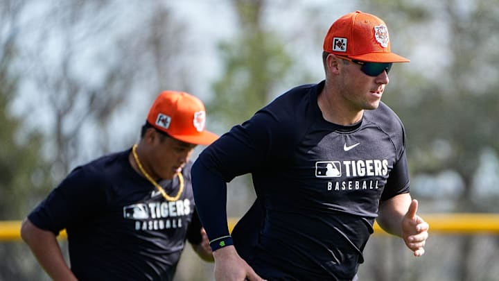 Detroit Tigers infielders Spencer Torkelson Hao-Yu Lee warm up during spring training at TigerTown in 2025.