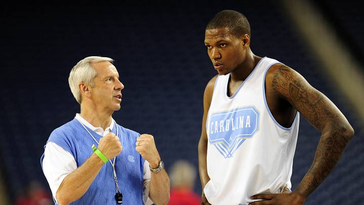 Apr 3, 2009; Detroit, MI, USA; North Carolina Tar Heels head coach Roy Williams (left) talks with forward Deon Thompson during practice the day before the semifinals of the Final Four in the 2009 NCAA mens basketball tournament at Ford Field. Mandatory Credit: Bob Donnan-Imagn Images