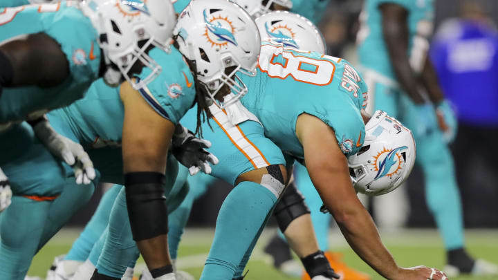 Sep 29, 2022; Cincinnati, Ohio, USA; Miami Dolphins guard Connor Williams (58) snaps the ball in the second half against the Cincinnati Bengals at Paycor Stadium. Mandatory Credit: Katie Stratman-USA TODAY Sports