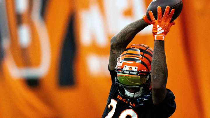 Cincinnati Bengals cornerback Cam Taylor-Britt (29) catches a pass during an interception drill at Bengals spring practice at the IEL Indoor Facility in Cincinnati on Tuesday, June 11, 2024.