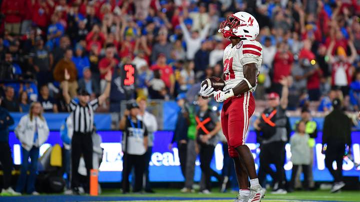 Nov 8, 2025; Pasadena, California, USA; Nebraska Cornhuskers running back Emmett Johnson (21) celebrates his touchdown scored against the UCLA Bruins during the first half at the Rose Bowl. Mandatory Credit: Gary A. Vasquez-Imagn Images