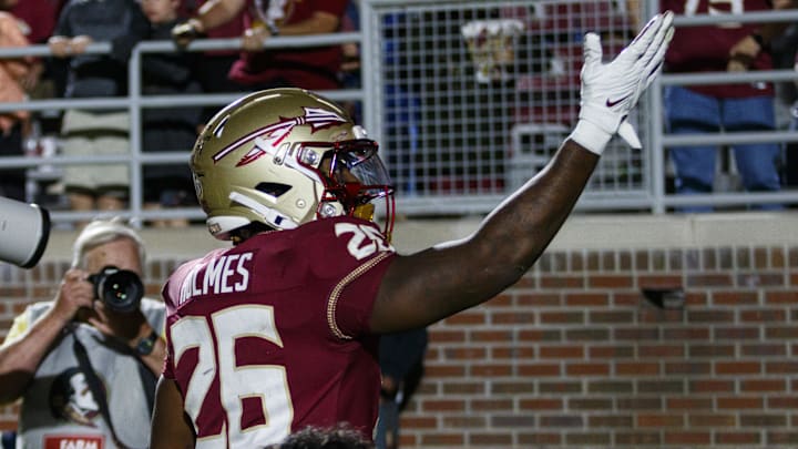 Nov 18, 2023; Tallahassee, Florida, USA;  Florida State Seminoles running back Caziah Holmes (26) celebrates a touchdown against the North Alabama Lions during the third quarter at Doak S. Campbell Stadium. Mandatory Credit: Morgan Tencza-Imagn Images