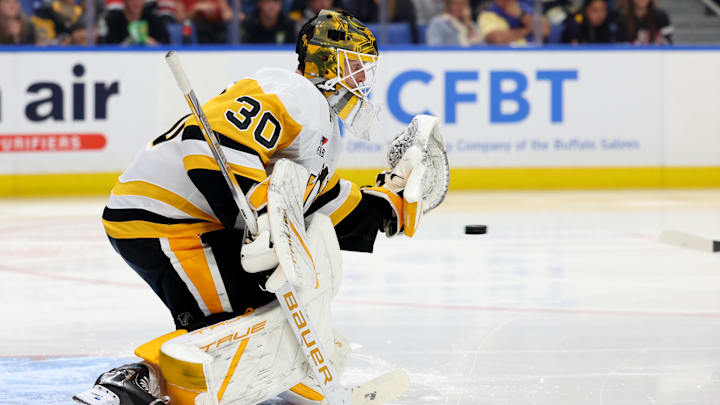 Sep 21, 2024; Buffalo, New York, USA;  Pittsburgh Penguins goalie Joel Blomqvist (30) looks to make a save during the second period against the Buffalo Sabres at KeyBank Center. Mandatory Credit: Timothy T. Ludwig-Imagn Images