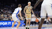 Mar 13, 2025; Charlotte, NC, USA; Georgia Tech Yellow Jackets forward Duncan Powell (31) handles the ball defended by Duke Blue Devils guard Kon Knueppel (7) during the first half at Spectrum Center. Mandatory Credit: Jim Dedmon-Imagn Images