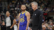 Feb 15, 2024; Salt Lake City, Utah, USA; Golden State Warriors guard Stephen Curry (30) and head coach Steve Kerr talk on the sideline during the first quarter against the Utah Jazz at Delta Center. Mandatory Credit: Chris Nicoll-Imagn Images