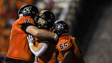 Ryle's Max Neumann (71) celebrates after Jacob Savage (21) scores a touchdown against Campbell County in the first half at Ryle High School Oct. 11, 2024.