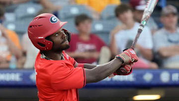 May 21, 2025; Hoover, AL, USA; Georgia left fielder Tre Phelps (1) follows through as he connects with a pitch during the game with Oklahoma in the second round of the SEC Baseball Tournament at the Hoover Met.
