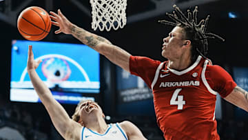 Arkansas Razorbacks forward Trevon Brazile (4) blocks the shot of Kentucky Wildcats guard Travis Perry (11) in the first half Saturday Feb. 1, 2025 at Rupp Arena in Lexington, Kentucky.