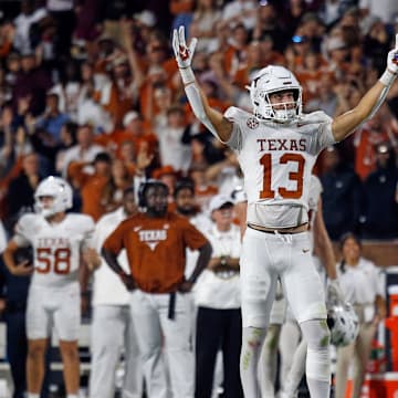 Oct 25, 2025; Starkville, Mississippi, USA; Texas Longhorns wide receiver Parker Livingstone (13) and Texas Longhorns wide receiver Rett Andersen (35) react during overtime against the Mississippi State Bulldogs at Davis Wade Stadium at Scott Field. Mandatory Credit: Petre Thomas-Imagn Images