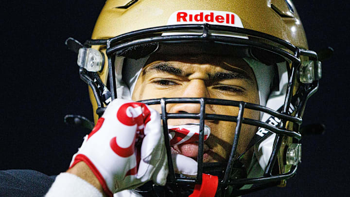 Penn's Tayshon Bardo gets something off of his tongue during the IHSAA Class 6A Sectional final between No. 2 Crown Point and Penn at Penn High School on Friday, Nov. 8, 2024, in Mishawaka.