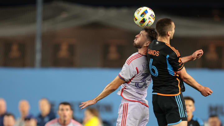 Jun 28, 2024; New York, New York, USA; New York City FC midfielder James Sands (6) battles Orlando City midfielder Jeorgio Kocevski (33) for the ball in the second half at Yankee Stadium. Mandatory Credit: Vincent Carchietta-USA TODAY Sports