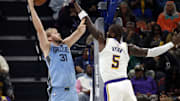 Oct 31, 2025; Memphis, Tennessee, USA; Memphis Grizzlies center Jock Landale (31) shoots as Los Angeles Lakers center Deandre Ayton (5) defends during the second quarter at FedExForum. Mandatory Credit: Petre Thomas-Imagn Images