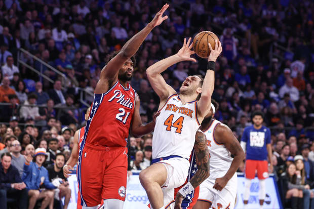 Apr 20, 2024; New York, New York, USA; New York Knicks forward Bojan Bogdanovic (44) looks to drive past Philadelphia 76ers center Joel Embiid (21) in the first quarter during game one of the first round for the 2024 NBA playoffs at Madison Square Garden. Mandatory Credit: Wendell Cruz-USA TODAY Sports