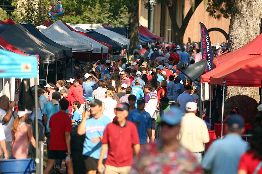 Ole Miss fans walk through the Grove pregame on Saturday.