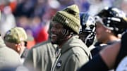 Oct 26, 2025; Baltimore, Maryland, USA; Baltimore Ravens quarterback Lamar Jackson (8) looks on from the sideline during the first quarter against the Chicago Bears at M&T Bank Stadium. Mandatory Credit: Tommy Gilligan-Imagn Images