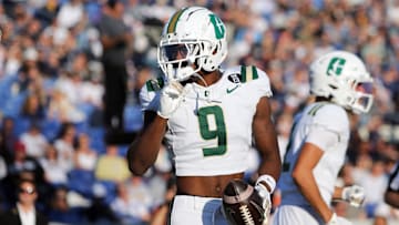 Oct 19, 2024; Annapolis, Maryland, USA; Charlotte 49ers wide receiver O'Mega Blake (9) celebrates after scoring a touchdown during the first half against the Navy Midshipmen at Navy-Marine Corps Memorial Stadium. Mandatory Credit: Daniel Kucin Jr.-Imagn Images
