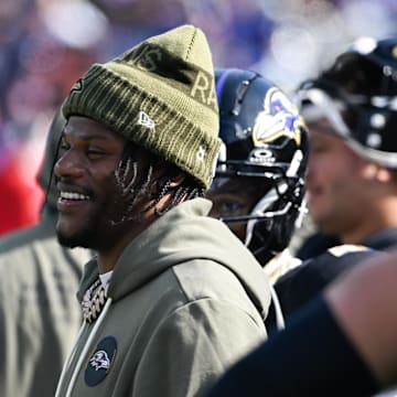 Oct 26, 2025; Baltimore, Maryland, USA; Baltimore Ravens quarterback Lamar Jackson (8) looks on from the sideline during the first quarter against the Chicago Bears at M&T Bank Stadium. Mandatory Credit: Tommy Gilligan-Imagn Images