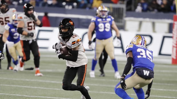 Nov 11, 2023; Winnipeg, Manitoba, CAN;  BC Lions wide receiver Alexander Hollins (13) makes a catch as he is covered by Winnipeg Blue Bombers defensive back Demerio Houston (35) during the second half of the game at IG Field. Winnipeg wins 24-13 to advance to Grey Cup. Mandatory Credit: Bruce Fedyck-USA TODAY Sports.