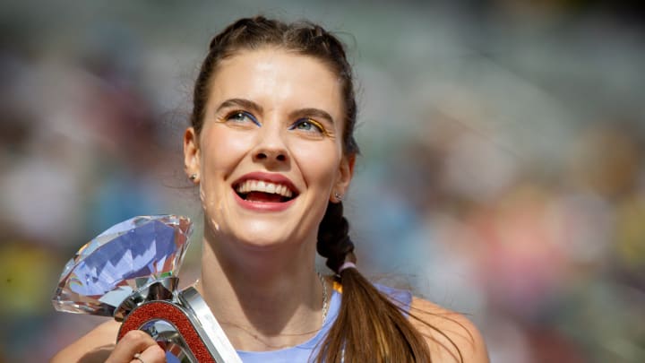 Yaroslava Mahuchikh, of Ukraine, runs a victory lap after winning the women   s high jump during the second day of the annual Prefontaine Classic Sunday, Sept. 17, 2023, at Hayward Field in Eugene, Ore.