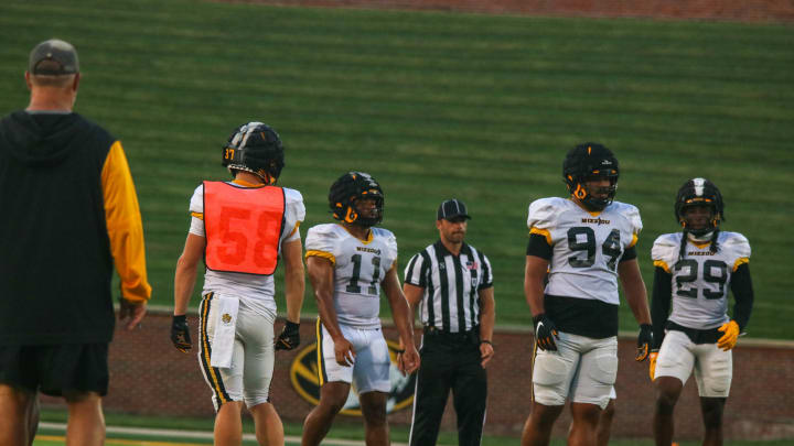 Aug 17, 2024; Columbia, Missouri USA; Missouri linebacker Corey Flagg [11] lines up for drills with defensive end Sam Williams [94] and cornerback Cameron Keys [29] during practice. / Amber Winkler / MissouriOnSi