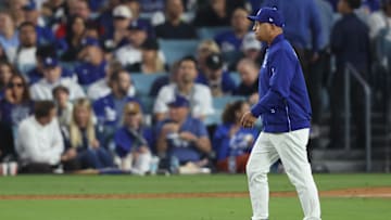Oct 27, 2025; Los Angeles, California, USA; Los Angeles Dodgers manager Dave Roberts (30) walks to the mound during the fifth inning against the Toronto Blue Jays in game three of the 2025 MLB World Series at Dodger Stadium. Mandatory Credit: Kiyoshi Mio-Imagn Images