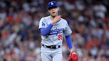 Jul 28, 2024; Houston, Texas, USA; Los Angeles Dodgers relief pitcher Joe Kelly (99) reactss after delivering a pitch against the Houston Astros during the eighth inning at Minute Maid Park. Mandatory Credit: Erik Williams-Imagn Images