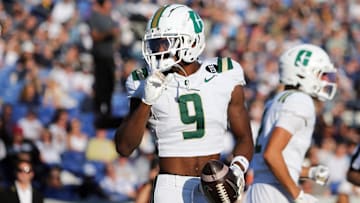 Oct 19, 2024; Annapolis, Maryland, USA; Charlotte 49ers wide receiver O'Mega Blake (9) celebrates after scoring a touchdown during the first half against the Navy Midshipmen at Navy-Marine Corps Memorial Stadium. Mandatory Credit: Daniel Kucin Jr.-Imagn Images