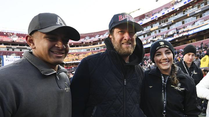 Dec 14, 2024; Landover, Maryland, USA;  Dave Portnoy poses with solders before the between the Army Black Knights and the Navy Midshipmen  at Commanders Field. Mandatory Credit: Tommy Gilligan-Imagn Images