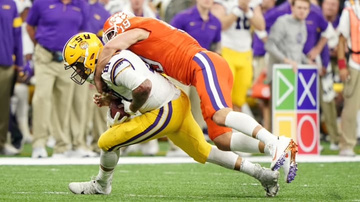 Jan 13, 2020; New Orleans, Louisiana, USA; LSU Tigers tight end Thaddeus Moss (81) makes a catch against Clemson Tigers safety Tanner Muse (19) in the fourth quarter in the College Football Playoff national championship game at Mercedes-Benz Superdome.