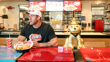 TikTok Animal Welfare Activist Lee Asher Accepts $100,000 Check from Raising Cane's for The Asher