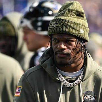 Oct 26, 2025; Baltimore, Maryland, USA; Baltimore Ravens quarterback Lamar Jackson (8) looks on from the sideline during the first quarter against the Chicago Bears at M&T Bank Stadium. Mandatory Credit: Tommy Gilligan-Imagn Images
