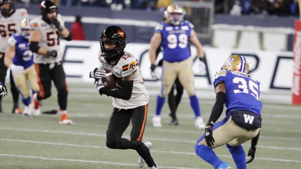 Nov 11, 2023; Winnipeg, Manitoba, CAN;  BC Lions wide receiver Alexander Hollins (13) makes a catch as he is covered by Winnipeg Blue Bombers defensive back Demerio Houston (35) during the second half of the game at IG Field. Winnipeg wins 24-13 to advance to Grey Cup. Mandatory Credit: Bruce Fedyck-USA TODAY Sports.